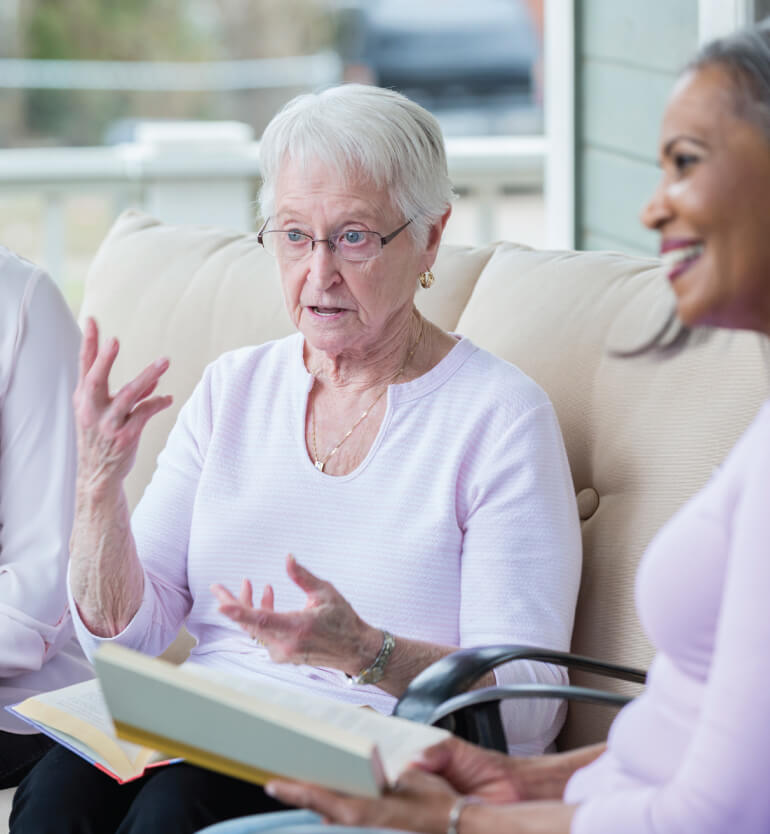 seniors discussing a book