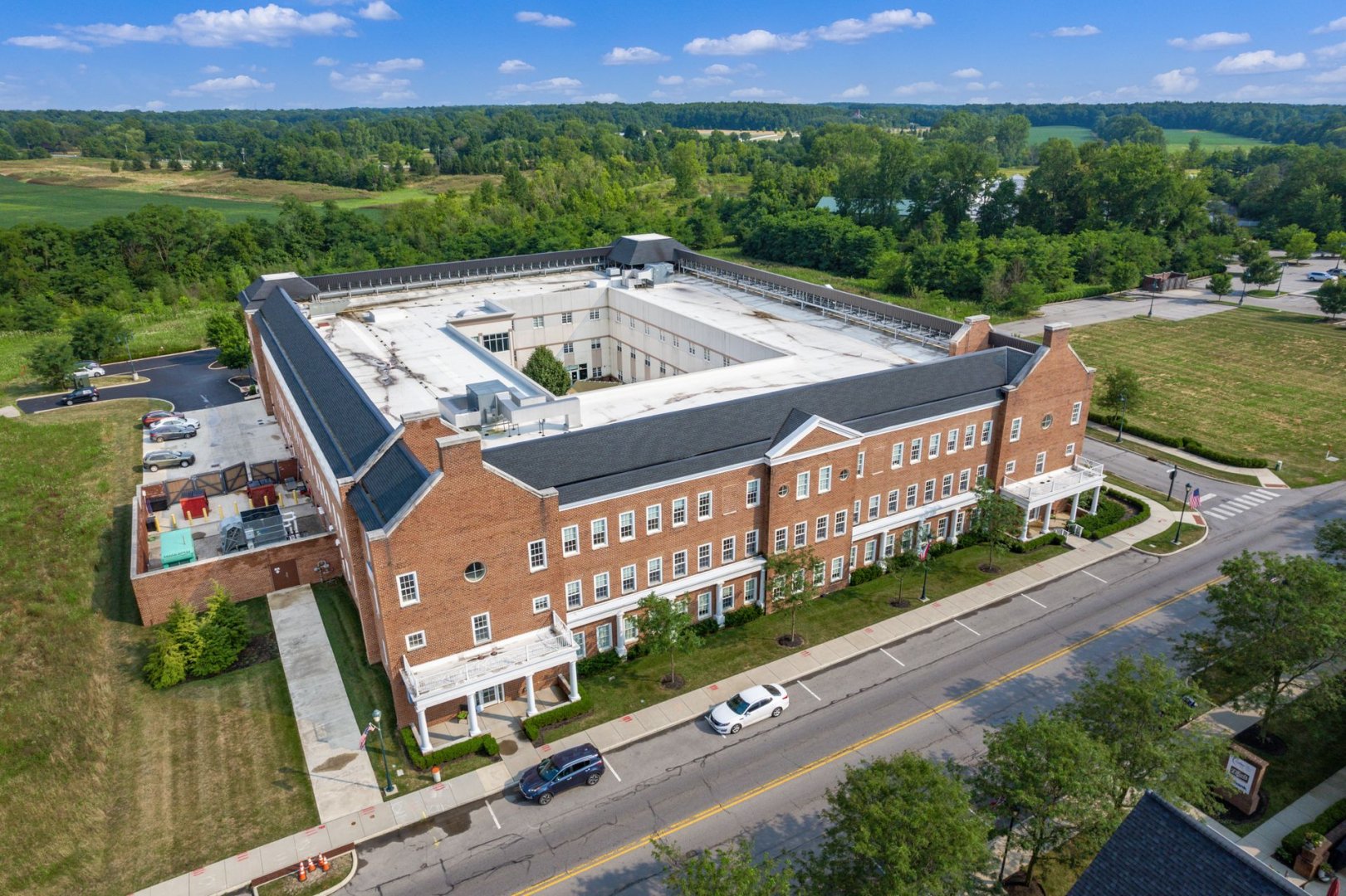 Aerial View of Senior Living Community in New Albany, OH Aerial view of a senior living community unit featuring brick architecture and spacious surroundings.