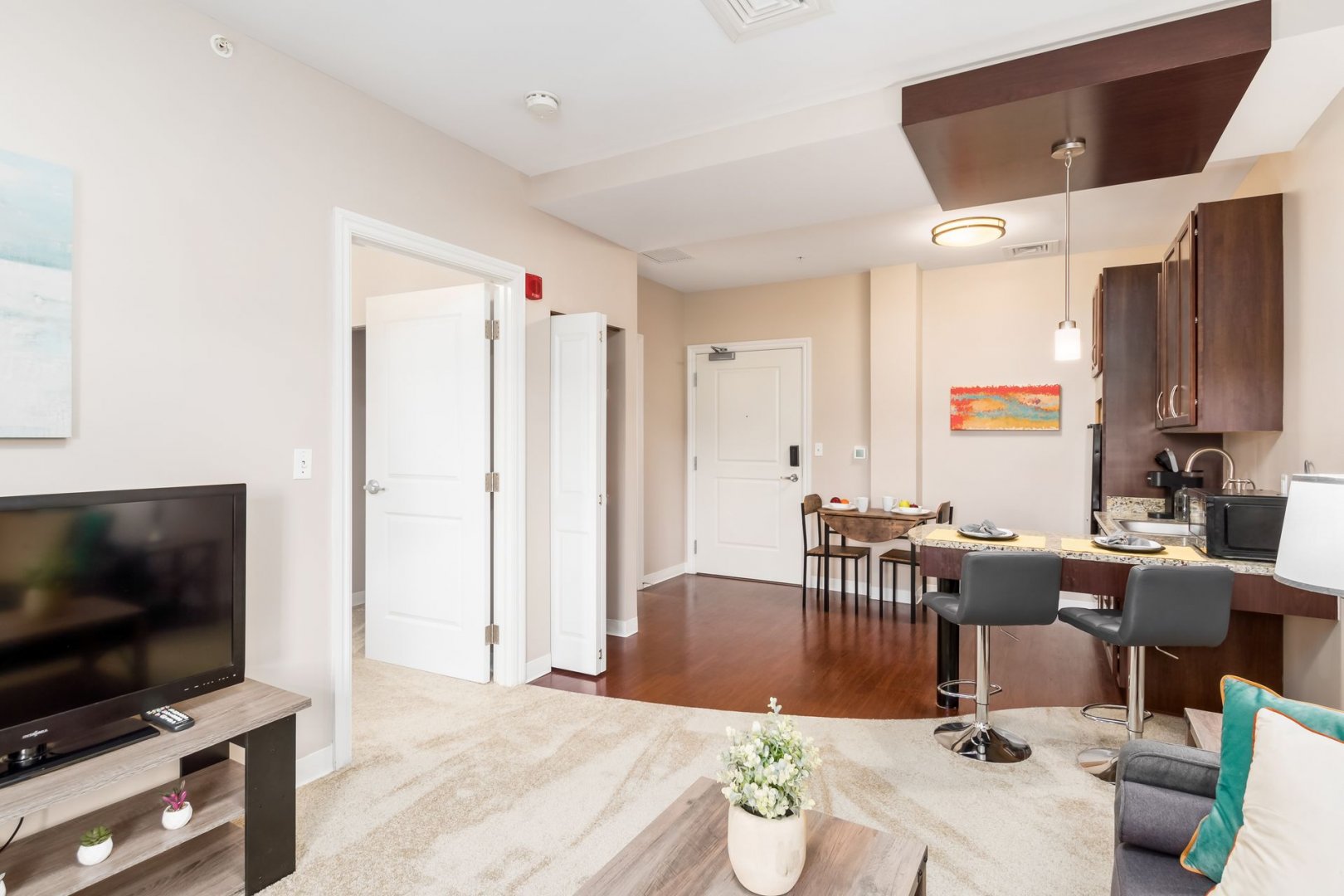 Modern Senior Living Unit in New Albany, OH Spacious living area in a senior living community with modern furniture and kitchen space.