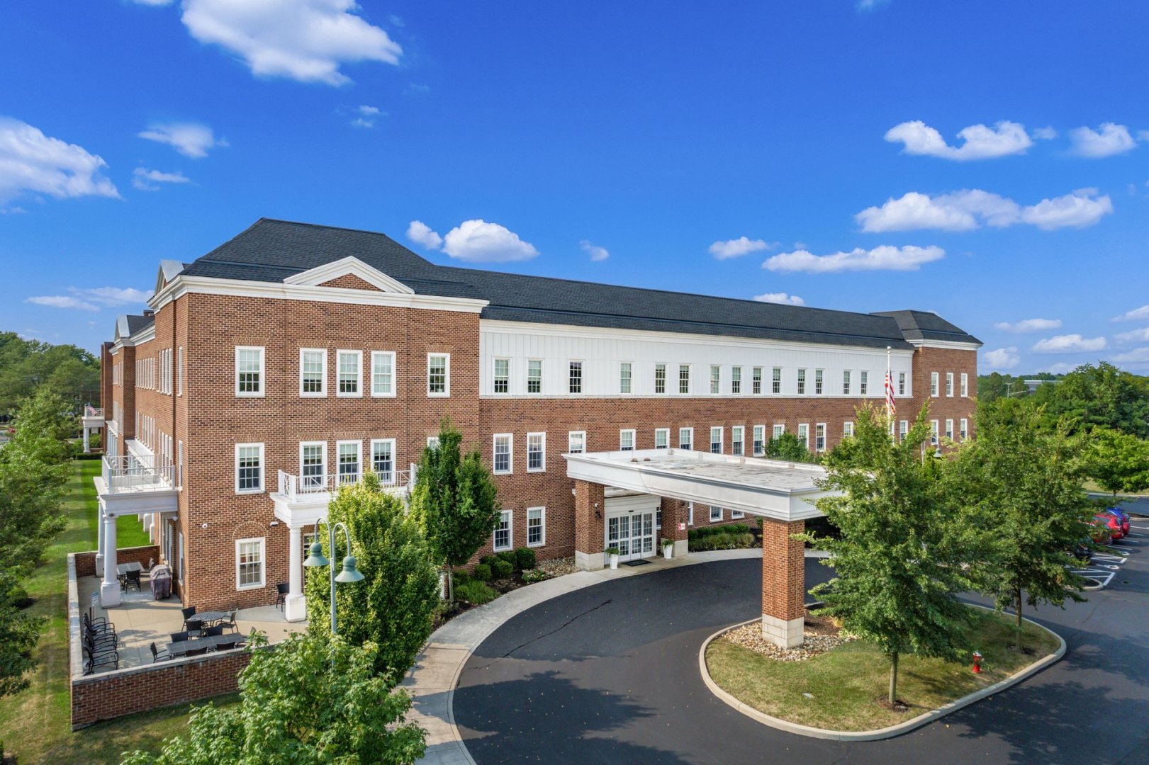 Three-Story Building at New Albany Three-story brick building with a driveway and landscaped greenery at New Albany, Ohio.