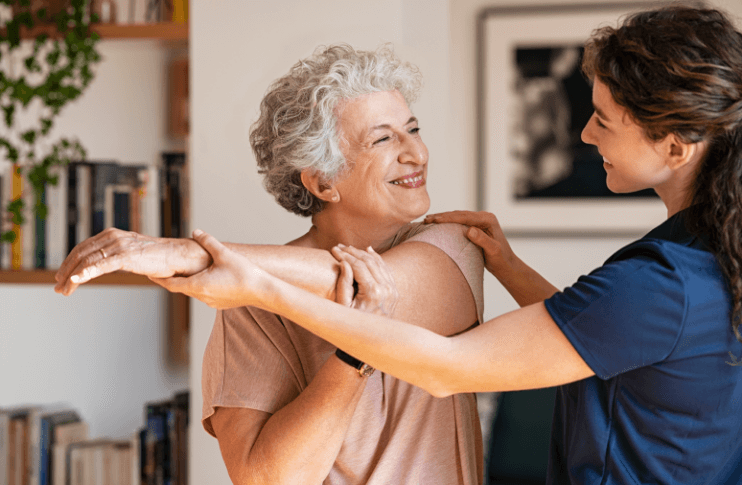 stretching (1) therapist helping senior woman stretch her arms